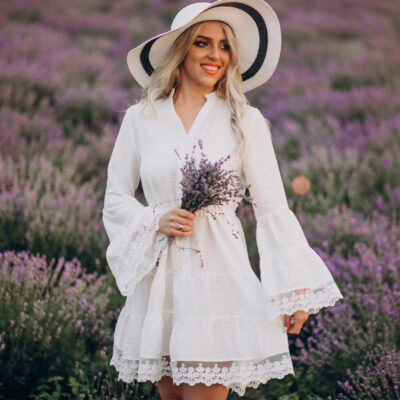 Beautiful woman in white dress in a lavander field